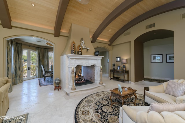 living room featuring vaulted ceiling with beams and wooden ceiling