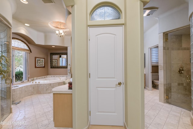 bathroom with plus walk in shower, a chandelier, and toilet