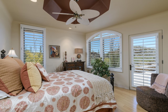 bedroom with access to outside, ceiling fan, and light hardwood / wood-style floors