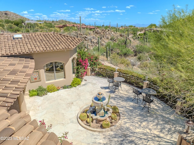 view of patio / terrace with a mountain view