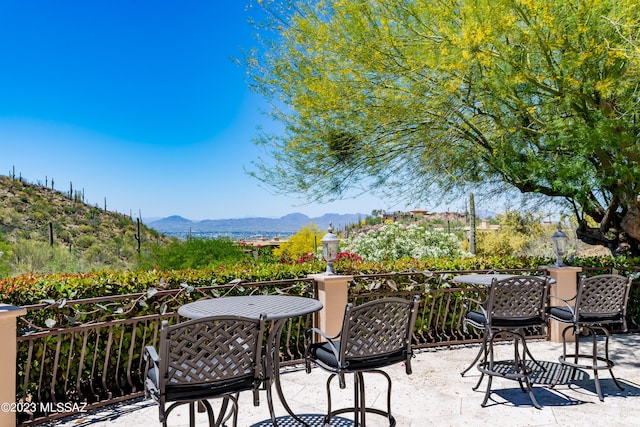 view of patio / terrace with a mountain view