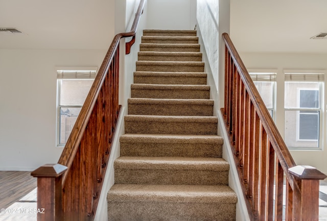 staircase featuring hardwood / wood-style floors