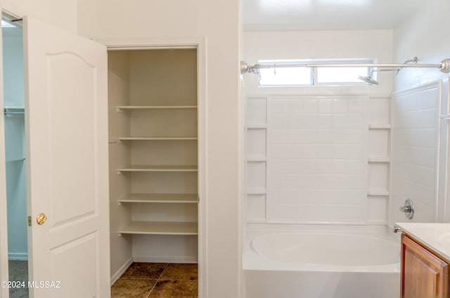 bathroom with shower / tub combination, tile patterned flooring, and vanity