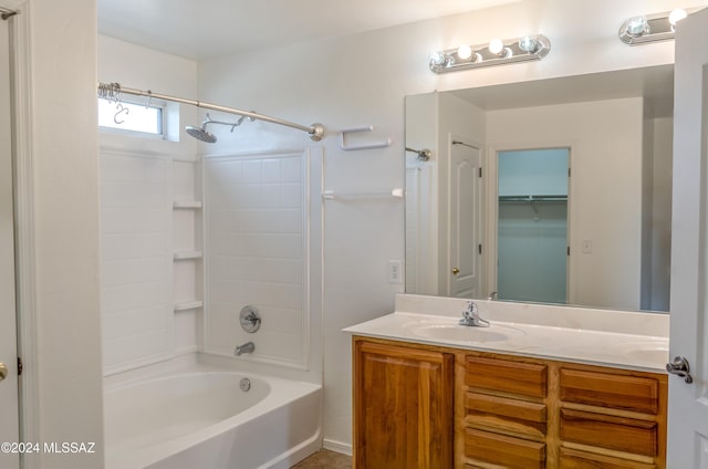 bathroom featuring vanity and shower / tub combination