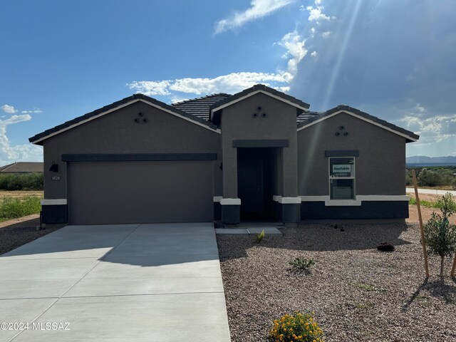 view of front of property featuring a garage