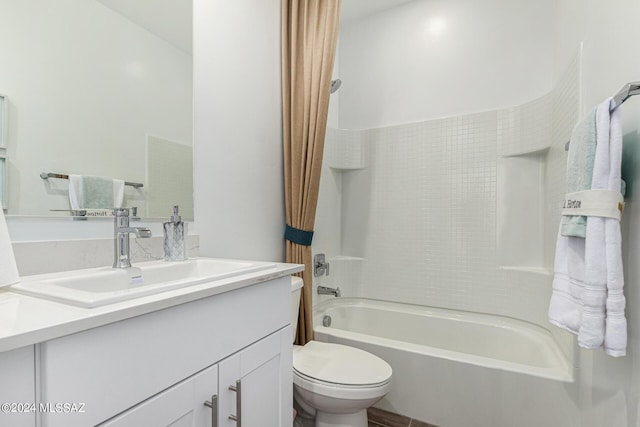 full bathroom featuring vanity, shower / tub combination, and toilet