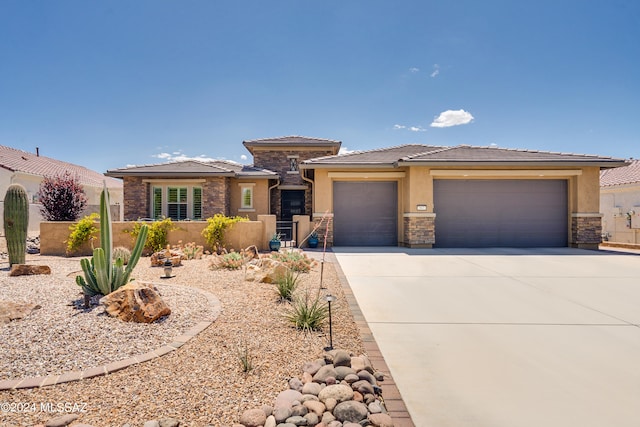 prairie-style home with a garage