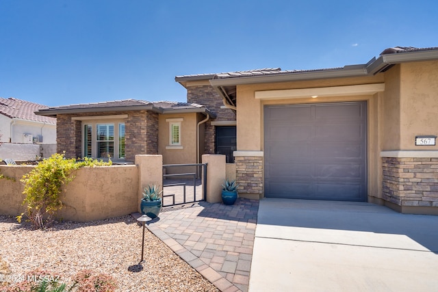 prairie-style home featuring a garage