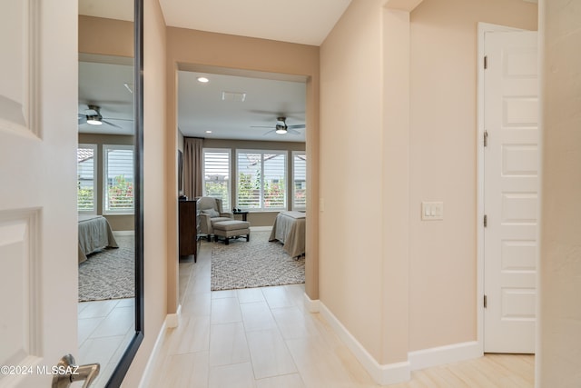 hallway featuring light tile patterned floors