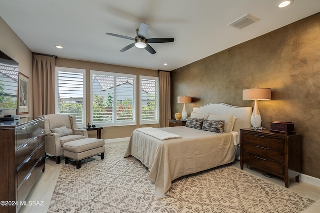 bedroom featuring light hardwood / wood-style floors and ceiling fan