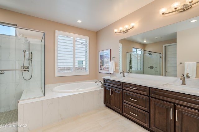 bathroom with tile patterned flooring, vanity, and independent shower and bath