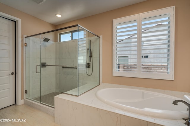 bathroom featuring plus walk in shower