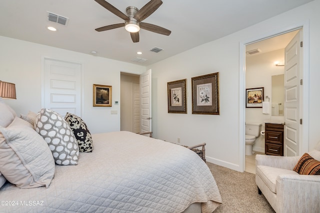 carpeted bedroom featuring connected bathroom and ceiling fan