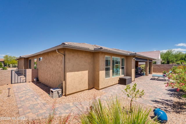 back of property with a patio area