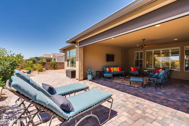 view of patio / terrace with an outdoor living space and ceiling fan