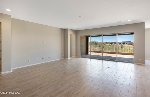 unfurnished room featuring light wood-type flooring