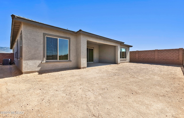 back of property featuring a patio area and central AC