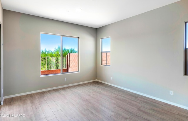 spare room with light wood-type flooring