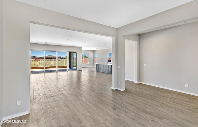 unfurnished living room with hardwood / wood-style floors