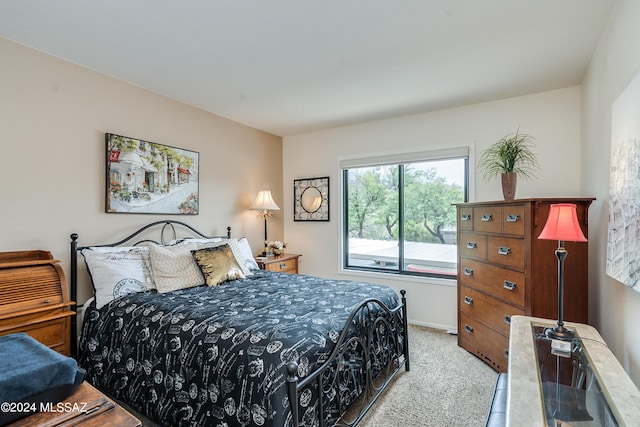 bedroom with light carpet