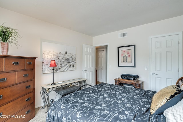 bedroom featuring light carpet and visible vents