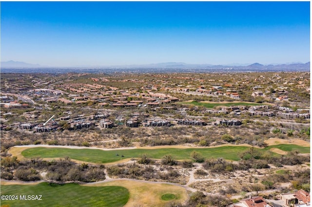 birds eye view of property featuring view of golf course and a mountain view