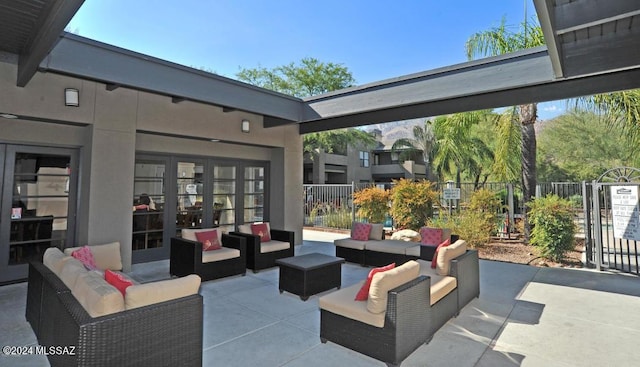 view of patio with outdoor lounge area and fence