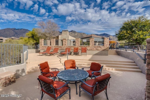 view of patio / terrace with a mountain view