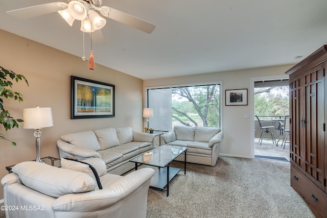 living room featuring light carpet and ceiling fan