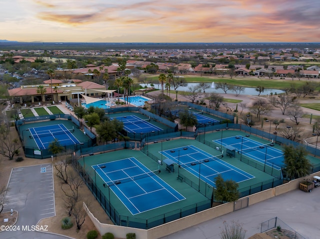 aerial view at dusk with a water view