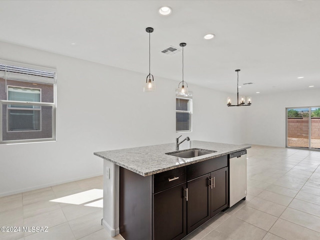 kitchen with a chandelier, recessed lighting, an island with sink, a sink, and stainless steel dishwasher