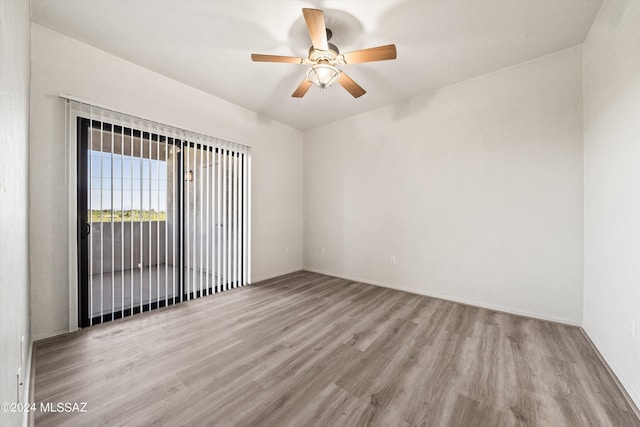 empty room featuring ceiling fan and light hardwood / wood-style floors