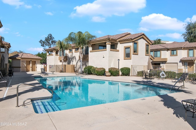 view of pool featuring a patio