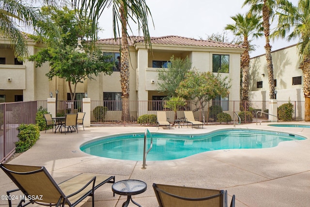 view of swimming pool featuring a patio