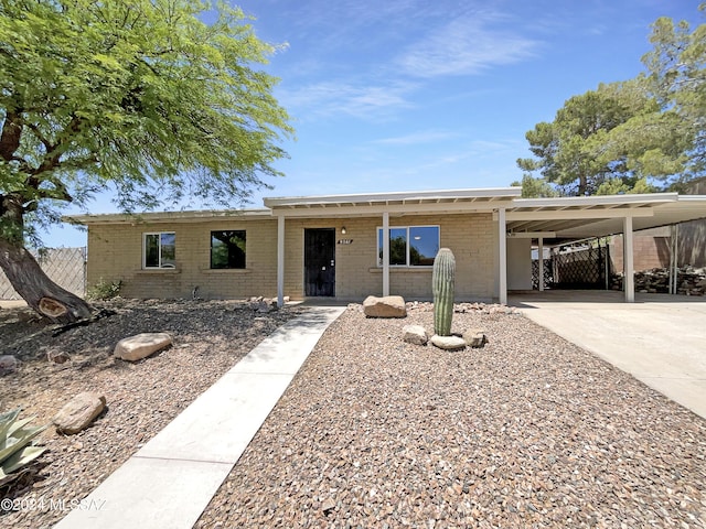 ranch-style house with a carport