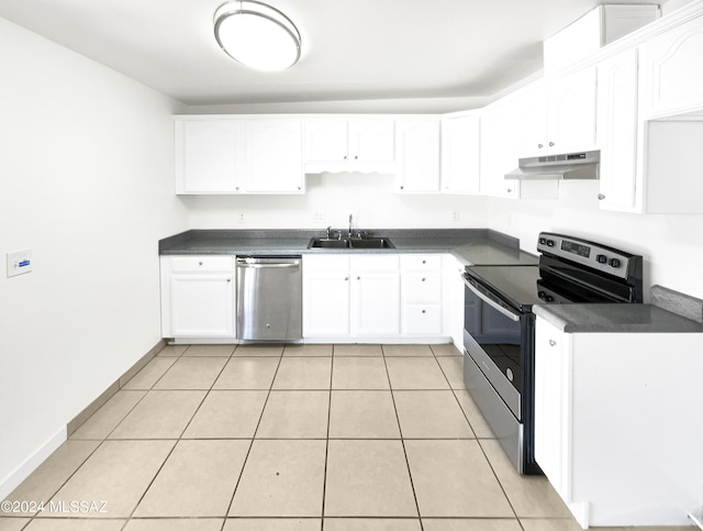 kitchen featuring light tile patterned floors, stainless steel appliances, white cabinetry, and sink