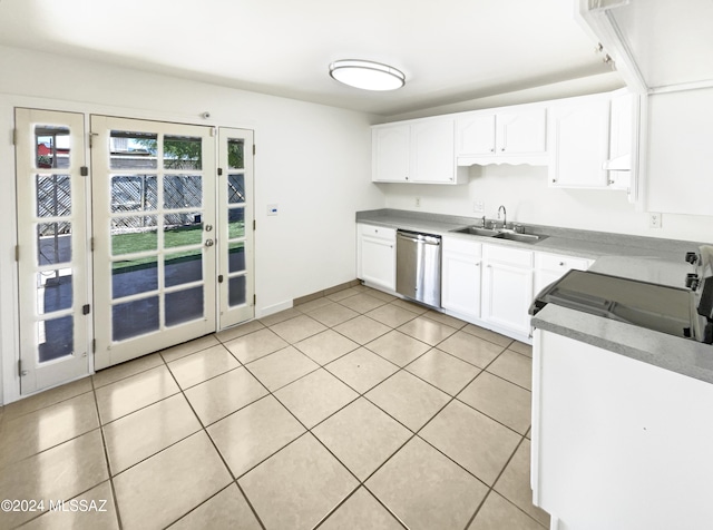 kitchen with stainless steel dishwasher, white cabinets, light tile patterned floors, and sink