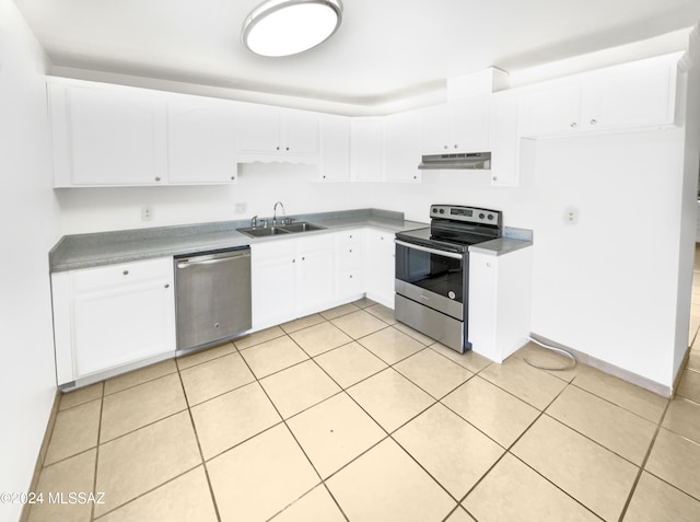 kitchen featuring sink, white cabinets, stainless steel appliances, and light tile patterned floors