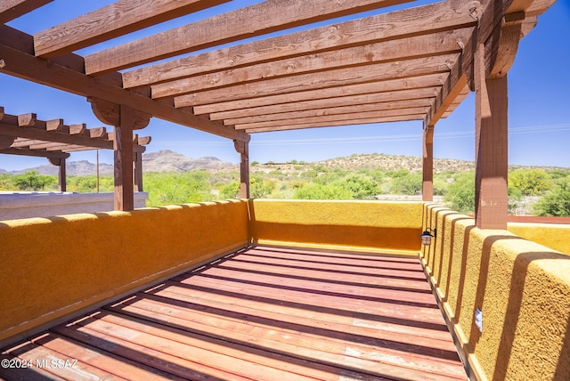 exterior space featuring a pergola and a mountain view