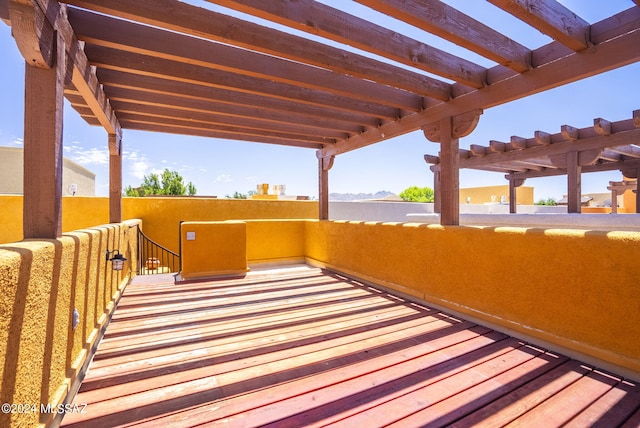deck with a pergola and a mountain view