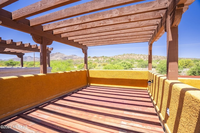 exterior space with a mountain view and a balcony