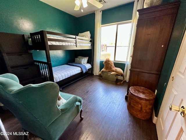 bedroom with ceiling fan and dark hardwood / wood-style floors