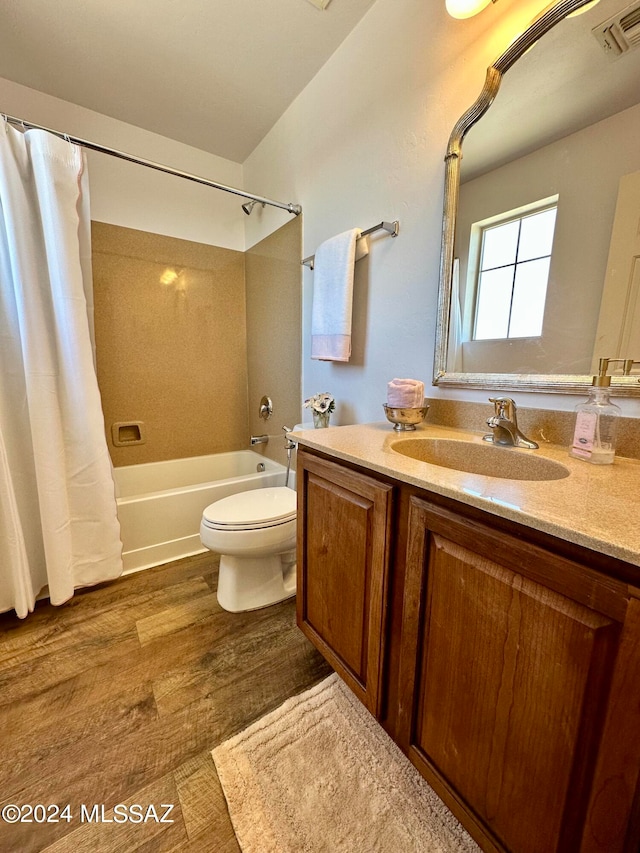 full bathroom featuring shower / bath combination with curtain, wood-type flooring, toilet, and vanity