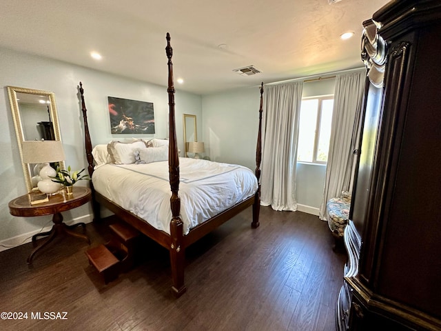 bedroom featuring dark hardwood / wood-style flooring