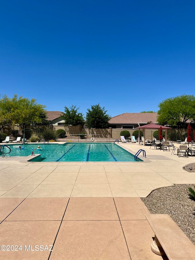 view of swimming pool with a patio area