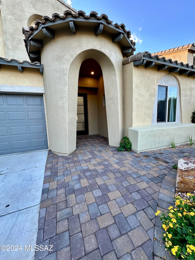 entrance to property featuring a garage