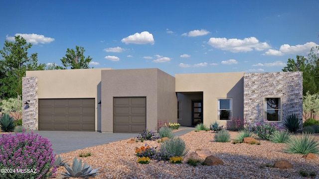 pueblo-style home featuring a garage