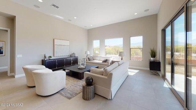 tiled living room with plenty of natural light