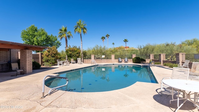 view of swimming pool featuring a patio area