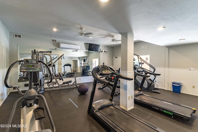 gym with a wall mounted AC and ceiling fan